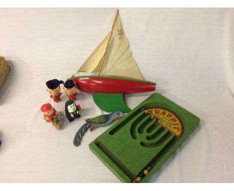 Pond yacht, 2 Noddy style egg cups, 2 clockwork toys, Chad Valley Trappit game & a balancing parrot