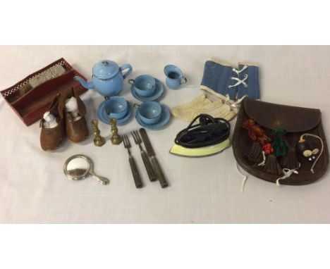 Various early 20th century  doll accessories including an enamel tea set, iron, cutlery, etc & a leather sporran