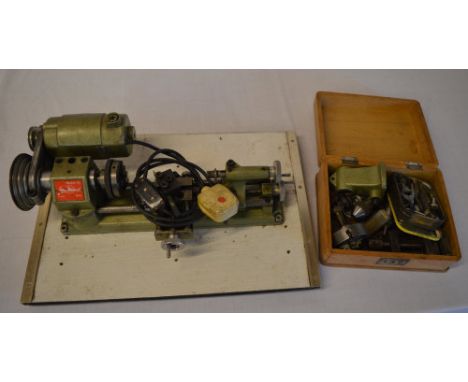 Unimat Modell SL Austrian watchmakers / engineers electric lathe mounted on board with accompanying tools in a small wooden c