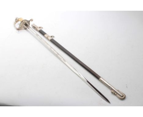 Contempory U.S. Naval Officers' sword with plastic simulated shagreen grip, plated mounts, etched blade with scabbard