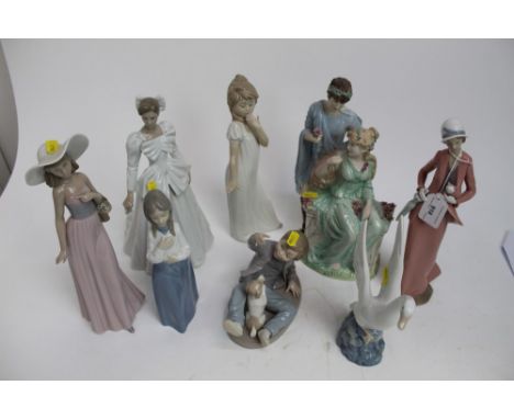 Group of eight NAO figures including lady carrying kitten and boy with dog plus a Wedgwood figure - Adoration number 1835 of 