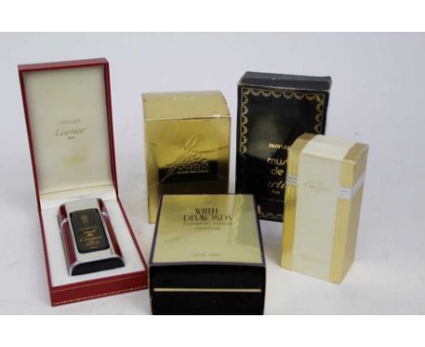 Group of vintage perfume bottles including Cartier