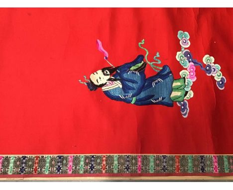 Large Chinese embroidered red silk wall hanging. Polychrome silk thread embroidered male and female figures. Brocade borders 