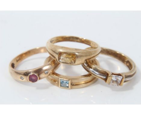 Four 9ct gold gem set rings including princess cut synthetic white stone ring, size N, princess cut aquamarine ring, size K½,