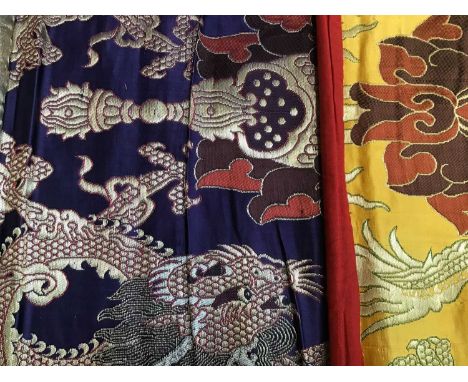 Chinese embroidered silk Dragon wall hanging plus three silk brocade dragon hangings. Also two Tibetan Thanka painted silk pa