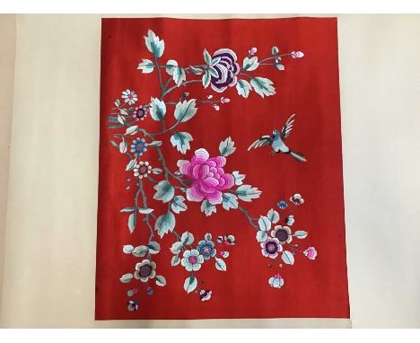 A pair of Chinese hand-made paper scroll with central red silk panel embroidered in polychrome silk thread flowers and bird. 
