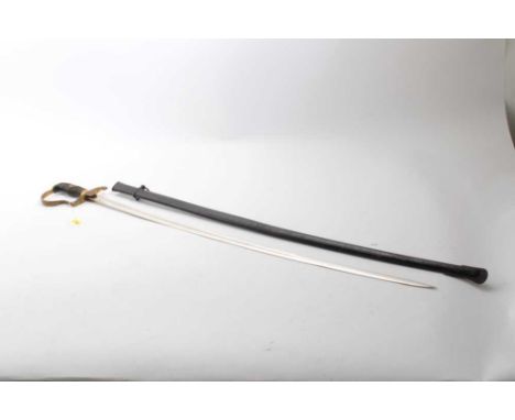 Nazi German Cavalry Officers' sword with gilt brass stirrup hilt with leaf decoration and eagle and swastika langet, curved f