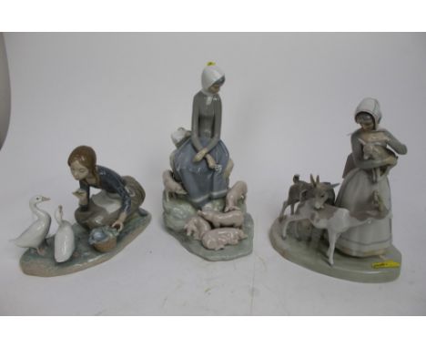 Three Lladro figures - girl with pigs, girl with goats and girl with geese