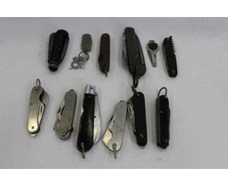 Three 1950s British Military folding knives together with a group of jack knives and other vintage knives (12 knives)