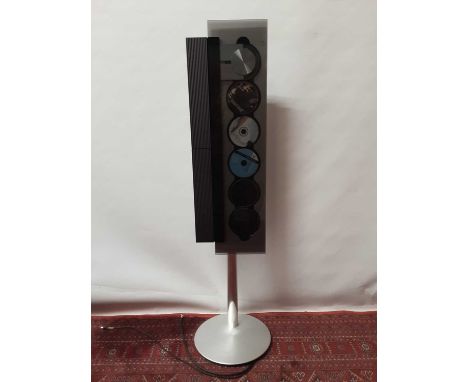 Bang & Olufsen Beosound six disc CD player with floor stand and remote controlNB. The buyer of this lot is to be made aware t