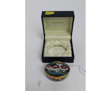 Moorcroft oval enamel trinket box decorated with toadstools, 6.5cm wide, in original box