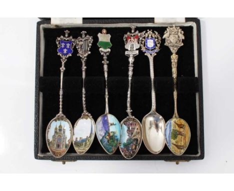 Group of six enamel souvenir teaspoons including four continental silver (stamped 800), one hallmarked silver and one plated,