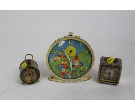 Two automaton clocks, including a Smiths Noddy example, together with one other clock with a woman holding a fan