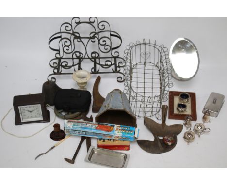 A group of miscellaneous metal items. Including a wirework planter, wrought iron magazine rack and a water hopper, etc.