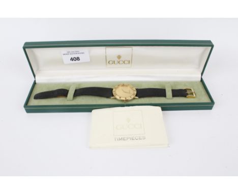 An early 1990s Gucci 3000.2.M gents quartz dress watch in original box with paperwork. With gold dial dagger hands, Roman num