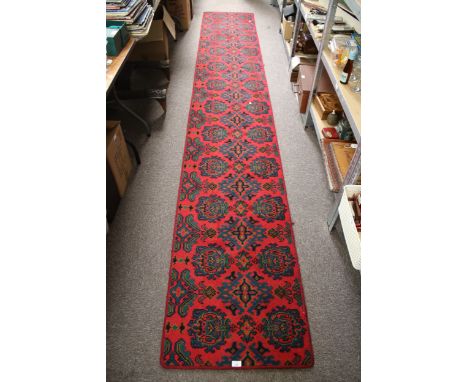 Large hall runner wool carpet. Red ground with geometric pattern, 400cm x 63cm