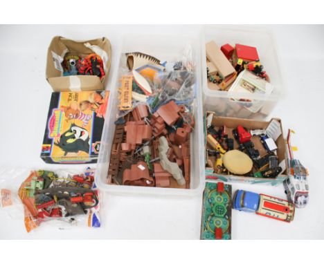 A collection of assorted vintage toys. Including Chad Valley Tom and Jerry Sliderama, Playmobil 'Fort Glory' cow boys and tin