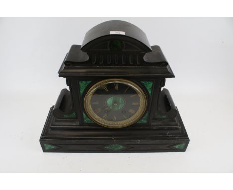 A Victorian black slate and green malachite mantle clock. Black dial with gold Roman numerals, H41cm