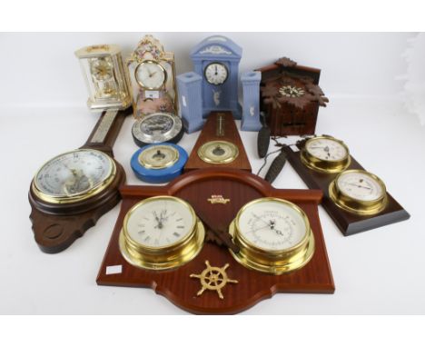 A collection of 20th century and later clocks and barometers. Including a Wedgwood 'Millennium' clock, etc. Max. H23cm