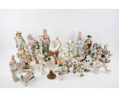 A collection of continental porcelain figures. Including Goebel, models of children, women in ball gowns, etc. Max. H28cm