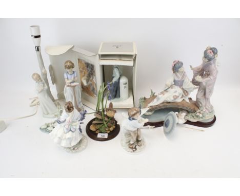 A collection of ceramic figurines. Including a boxed Lladro 'Springtime in Japan' figure, Lladro figures of swans, Coalport '