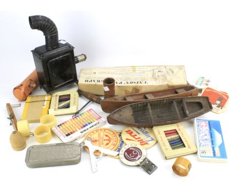 An assortment of 20th century collectables. Including an enamel 'Caravan Club' badge, tinplate toy magic lantern, a corkscrew