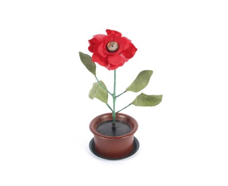 A German felt flower mounted clock in original box, circa 1930. With red felt petals, wire stem and green leaves, the small s