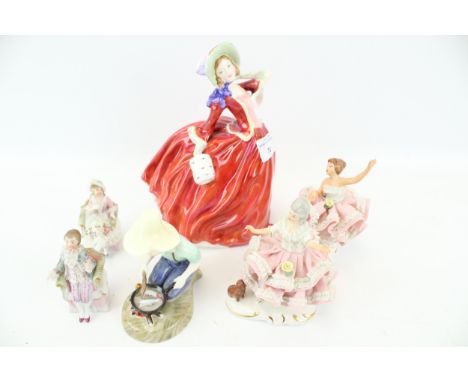 A collection of assorted vintage porcelain figures. Including two Royal Doulton figures, two Dresden figures and two other ce