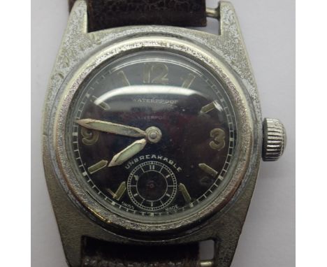 Military black faced mid size gents wristwatch on a leather strap CONDITION REPORT: This item is working at lotting.