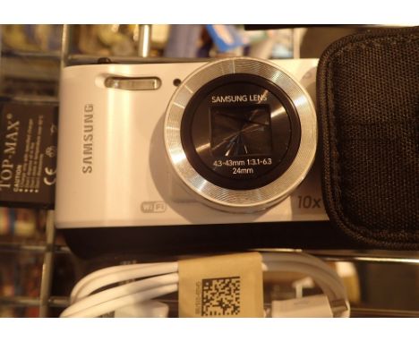 Samsung WB 30F 16.2 mega pixels wifi camera ( three batteries ) CONDITION REPORT: This item is fully working at lotting.
