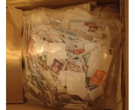 Box of first day cover postage stamps and loose stamps