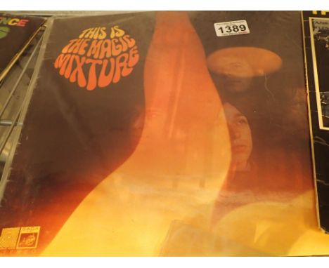 This is the Magic Mixture LP CONDITION REPORT: Light surface scratching to both sides, nothing deep.
