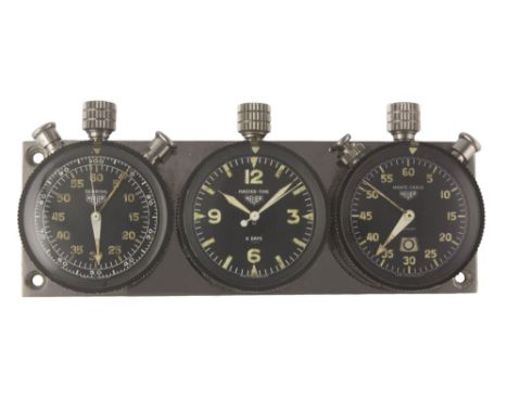 A RARE HEUER TRIPLE DASHBOARD SET CIRCA 1960s, CONSISTING OF A SEBRING 60 MINUTE SPLIT SECONDS TIMER, 8 DAY MASTER TIME CLOCK