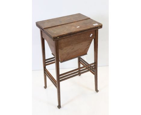 Early 20th century Oak Sewing / Work Table the twin hinged lid opening to a fitted interior including a silk lined well, reta