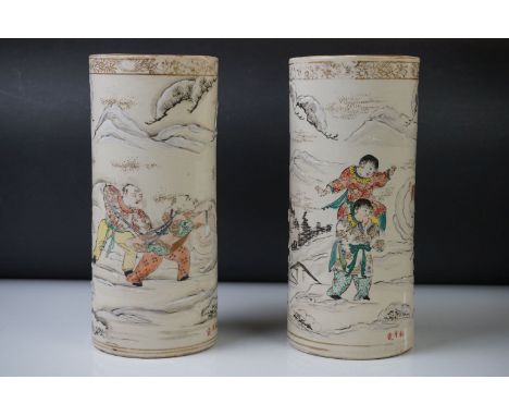 Pair of Chinese Porcelain Brush Pots, with enamelled decoration depicting figures playing in a mountainous snow-covered lands