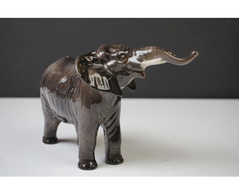 Beswick Elephant model, with trunk outstretched, gloss finish, model no. 974 (measures appprox 12cm high) 