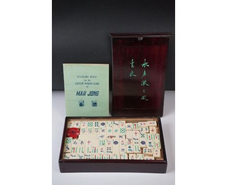 Chinese Mah-jong Game with bone and bamboo playing pieces, instruction booklet, contained in a Wooden Box with sliding lid 