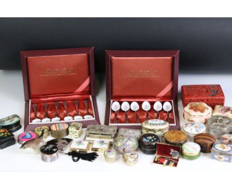 A collection of trinket boxes to include enamel examples together with two cased sets of silver plated enamel tea spoons. 