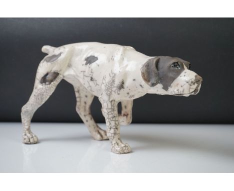 Keza Rudge Studio Pottery model of a Pointer gun dog, front leg raised, signed to underside, measures approx 32cm long 