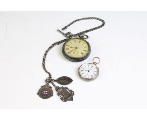 A hallmarked sterling silver cased pocket watch together with a fob watch and Albert chain with fobs. 