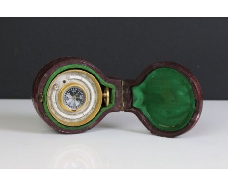 An early 20th century Ross pocket barometer, thermometer and compass in original fitted case. 