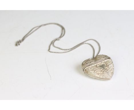 A fully hallmarked sterling silver heart shaped pendant on a sterling silver chain link necklace. 