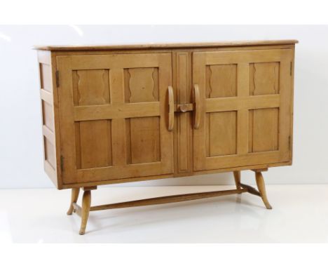 Ercol Blonde Elm Sideboard,  model 120, the two doors opening to two drawers and a shelf, 122cm long x 46cm deep x 83cm high 