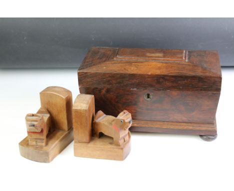 Regency Rosewood Tea Caddy of sarcophagus form with lion mask ring handles and raised on squat ball feet, 31cm wide x 19cm hi