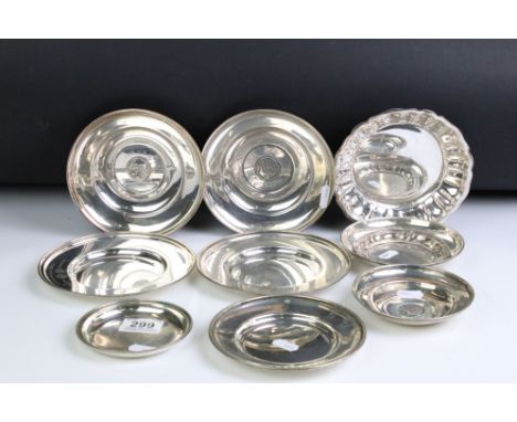 A collection of nine silver plated presentation dishes. 