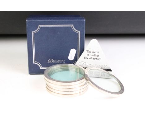 A set of six hallmarked 925 sterling silver mounted glass drinks coasters in original fitted display box. 