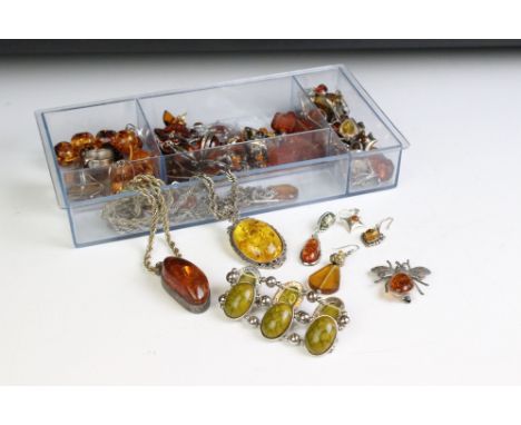 A large collection of mainly 925 sterling silver mounted Amber jewellery to include earrings, brooches, necklaces....etc. 