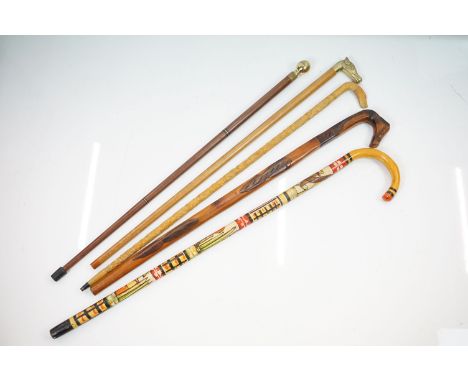 Walking Sticks - Five wooden walking sticks to include a navigational walking stick with hidden compass within a brass pommel