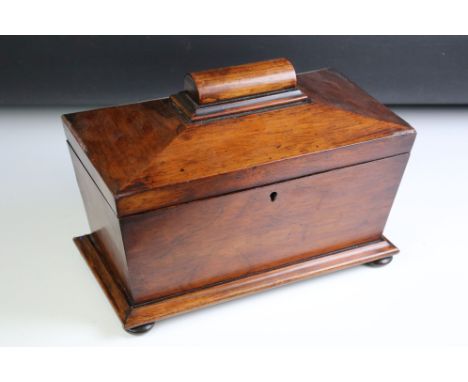 Regency Mahogany Tea Caddy of sarcophagus form, the hinged lid with two lidded compartments and central well for mixing bowl,