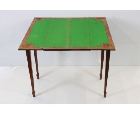 Early 20th century Oak Card Table, the twin hinged lids opening to a green baise playing surface with counter wells, raised o